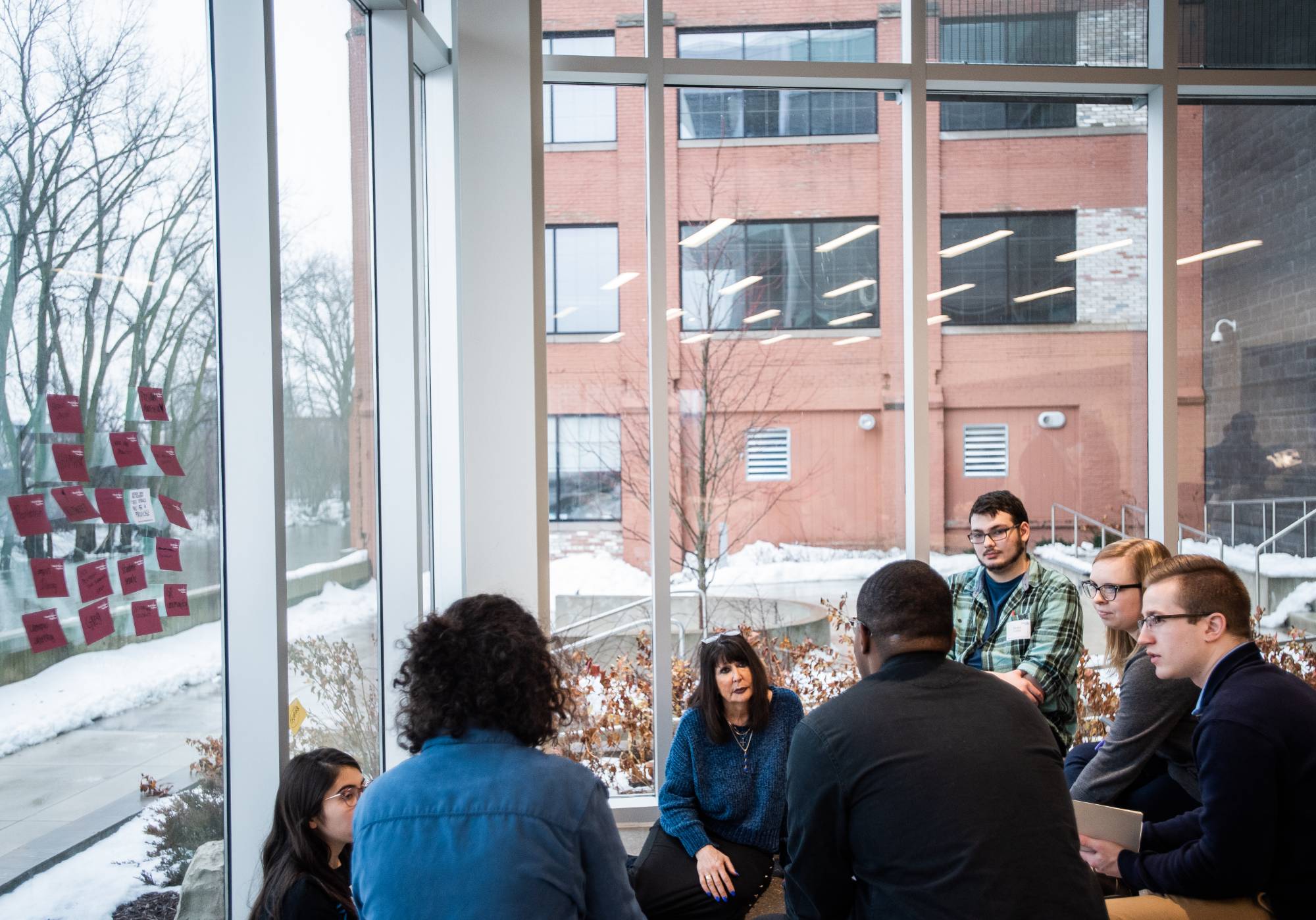 Image of students with President Mantella at design thinking conference